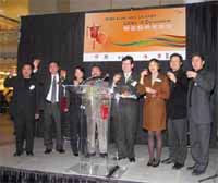 Officiating guests and sponsors joining Mrs. Rosanna Ure (3rd from the right), in a toasting ceremony at the Hong Kong Promotion in Calgary.
