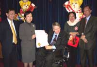 Photo shows Vancouver Mayor Sam Sullivan (centre) presenting the "Hong Kong Cultural and Heritage Day" proclamation to the Deputy Secretary (Culture) of the Home Affairs Bureau of the Hong Kong Special Administrative Region Government, Ms. Lolly Chiu (second left), at the Mayor's Office.  Also present are the Director of the Hong Kong Economic and Trade Office in Canada, Mr. Bassanio So (left), the leader of the 70-member Hong Kong Cultural Delegation, Ms. Shelley Lee (second right), and the Chair of the "Hong Kong Cultural and Heritage Celebrations", Mr. Johnny Fong (right). 
