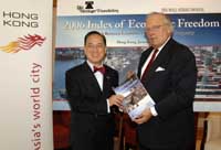 Chief Executive, Mr. Donald Tsang (left), is presented with a copy of the Heritage Foundation's 2006 Index of Economic Freedom from its President, Dr. Edwin Feulner 
