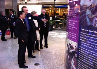 HKETO Director Bassanio So briefs Montreal business people the benefits of using Hong Kong as their business platform to China during a recent promotion there, highlighted by the premiere of "Kung Fu Hustle" 