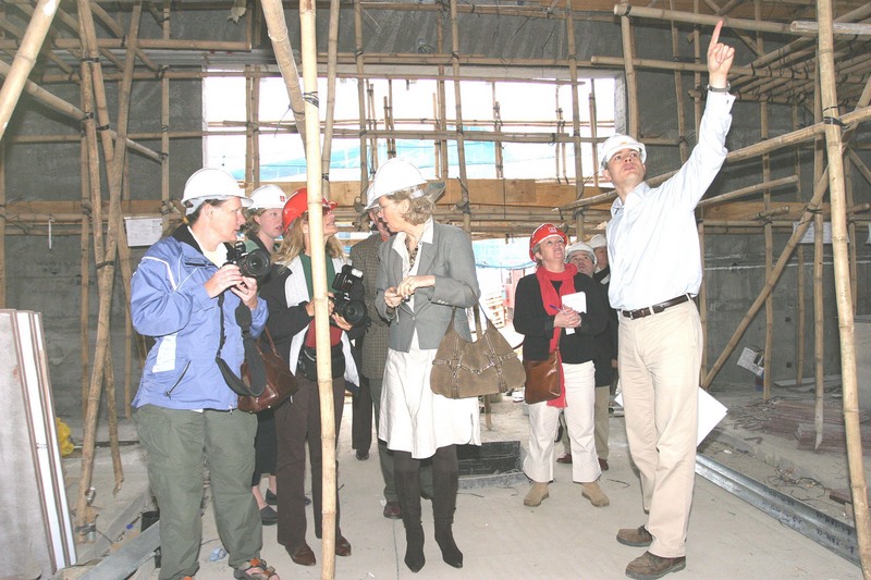 The equestrian journalists inspect the special stables being built for the 2008 Olympic Games.