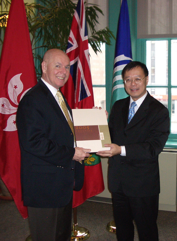 Mr. Bassanio So presenting a souvenir book to Mayor Larry O'Brien of Ottawa after the meeting.