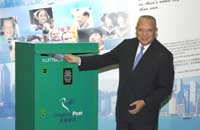 CE, Mr. Tung, posting the first "Hello from Hong Kong" postcard to a friend in United States. 