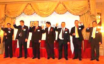 Mr John Rutherford of Invest Hong Kong (2nd right) proposes a toasting at the ceremony of RBS Capital Market to launch its services in Hong Kong.