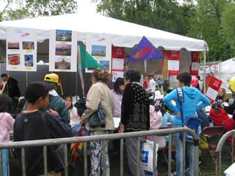 Visitors enthusiastically take  part in a variety of  fun-filled activities held at the HKETO booth.
