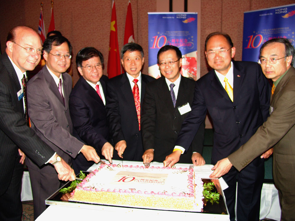 Performing  the "Cake Cutting" ceremony to celebrate the Hong Kong SAR10th anniversary in Vancouver are (from left to right) : Burnaby Councillor Mr Garth Evans, Parliamentary Secretary for the Asia-Pacific Initiative of British Columbia, Mr Richard Lee; Member of Parliament the Hon Raymond Chan; Chinese Consul General Mr Yang Qiang; Mr Bassanio So, HKETO Director; Mr John Yap, Government Caucus Chair of the Province of British Columbia; and Vancouver City Councillor Mr George Chow.