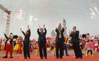 Vice-President Zeng Qinghong (2nd left); Chief Executive Donald Tsang (left); CEO of Walt Disney Company, Michael Eisner; and Walt Disney Company's President and COO, Bob Iger, celebrate the grand opening of Hong Kong Disneyland.